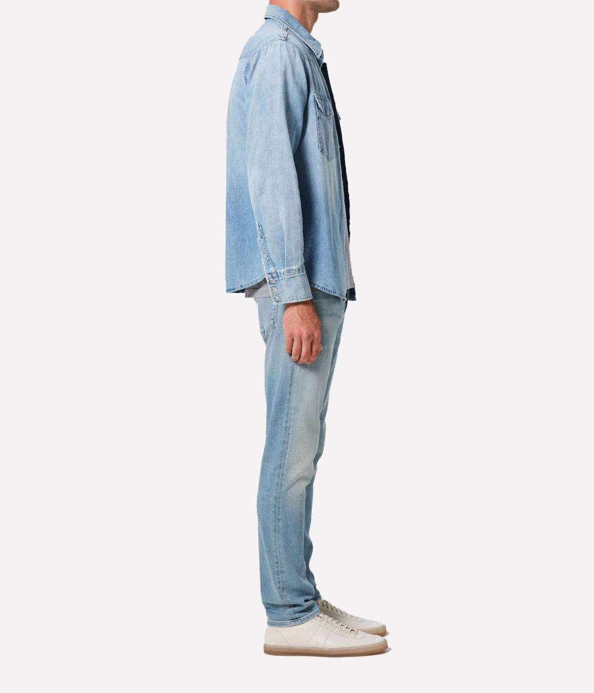 London Jean in Pavilion by Citizens of Humanity, featuring a slim fit through the hip and thigh with a tapered leg. Crafted from a stretch-enhanced fabric blend in a versatile mid-blue wash, these jeans offer a sleek, modern silhouette perfect for both casual and elevated looks.