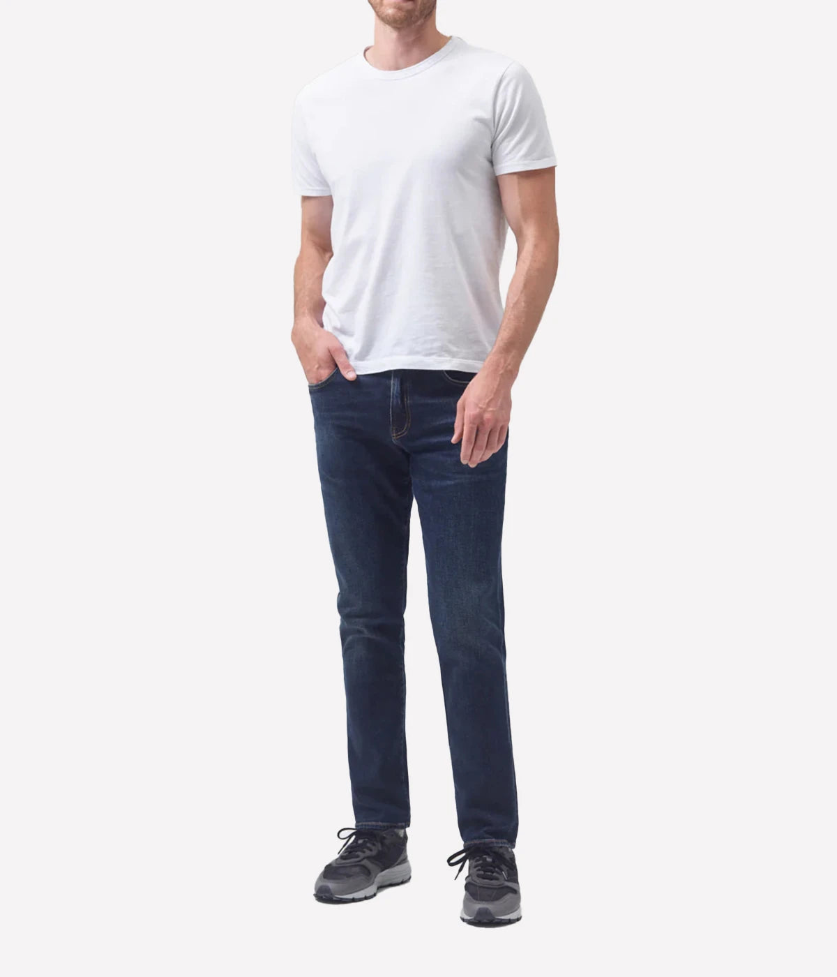 The London Slim Taper jeans paired with a white tee and sneakers for a casual yet refined outfit.