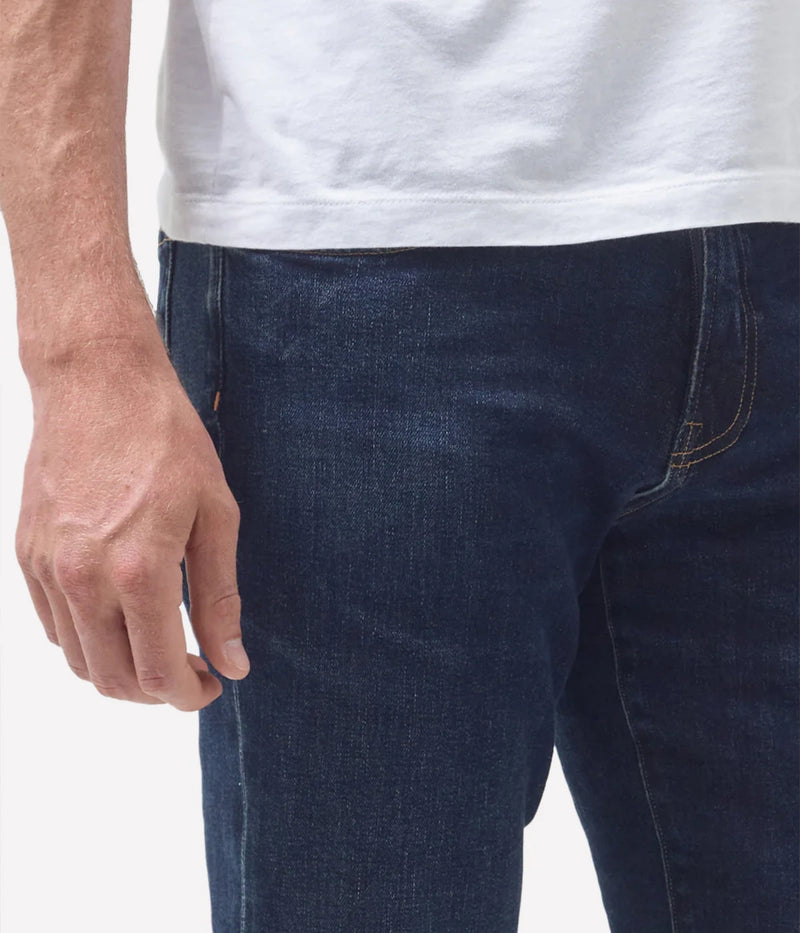 Close-up of the Perform denim texture, tonal stitching, and waistband, emphasising the premium craftsmanship.
