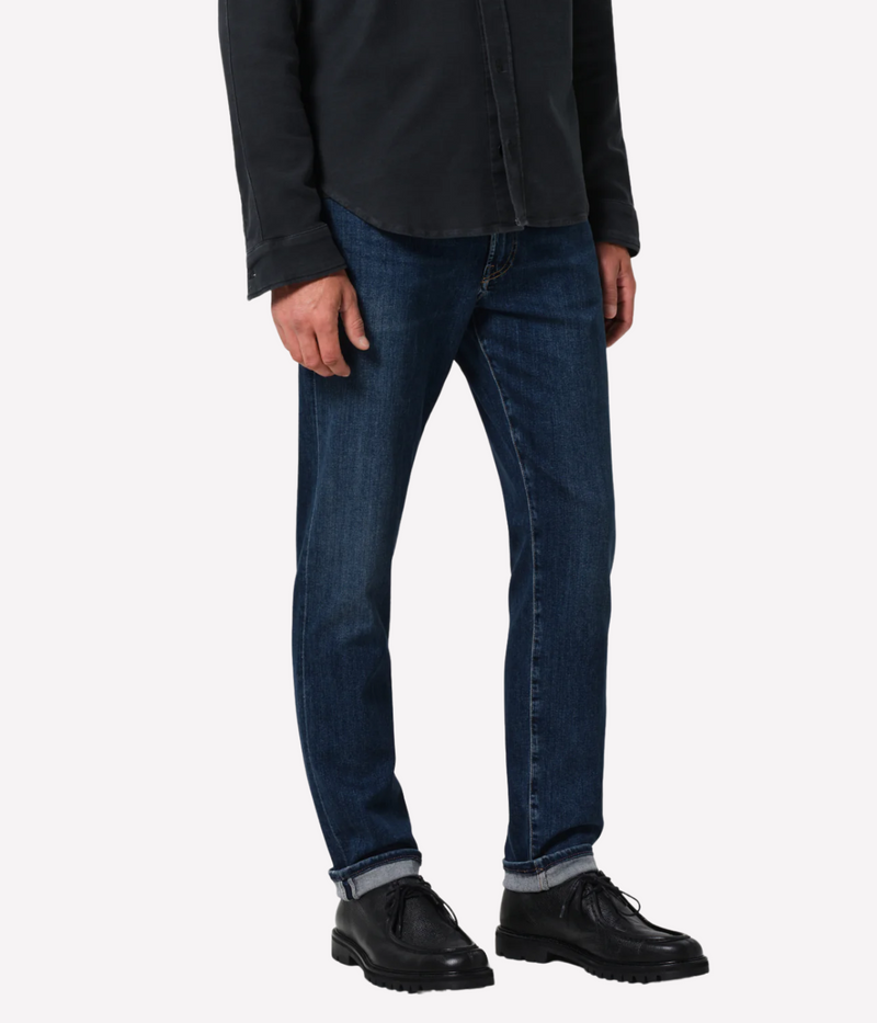 Citizens of Humanity London Jean in darker medium indigo—slim tapered fit with subtle fading, whiskering, and soft stretch midweight denim.