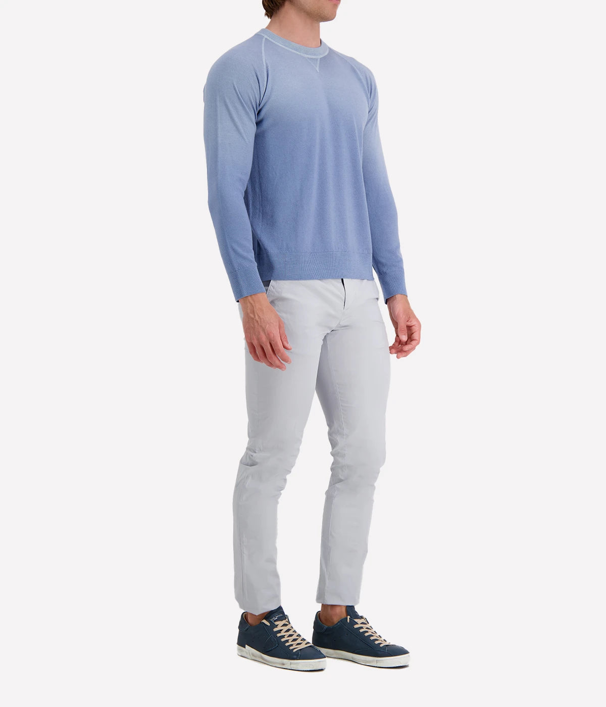 Side profile of the Eleventy sky blue long-sleeve sweater, highlighting the soft knit texture and relaxed fit.