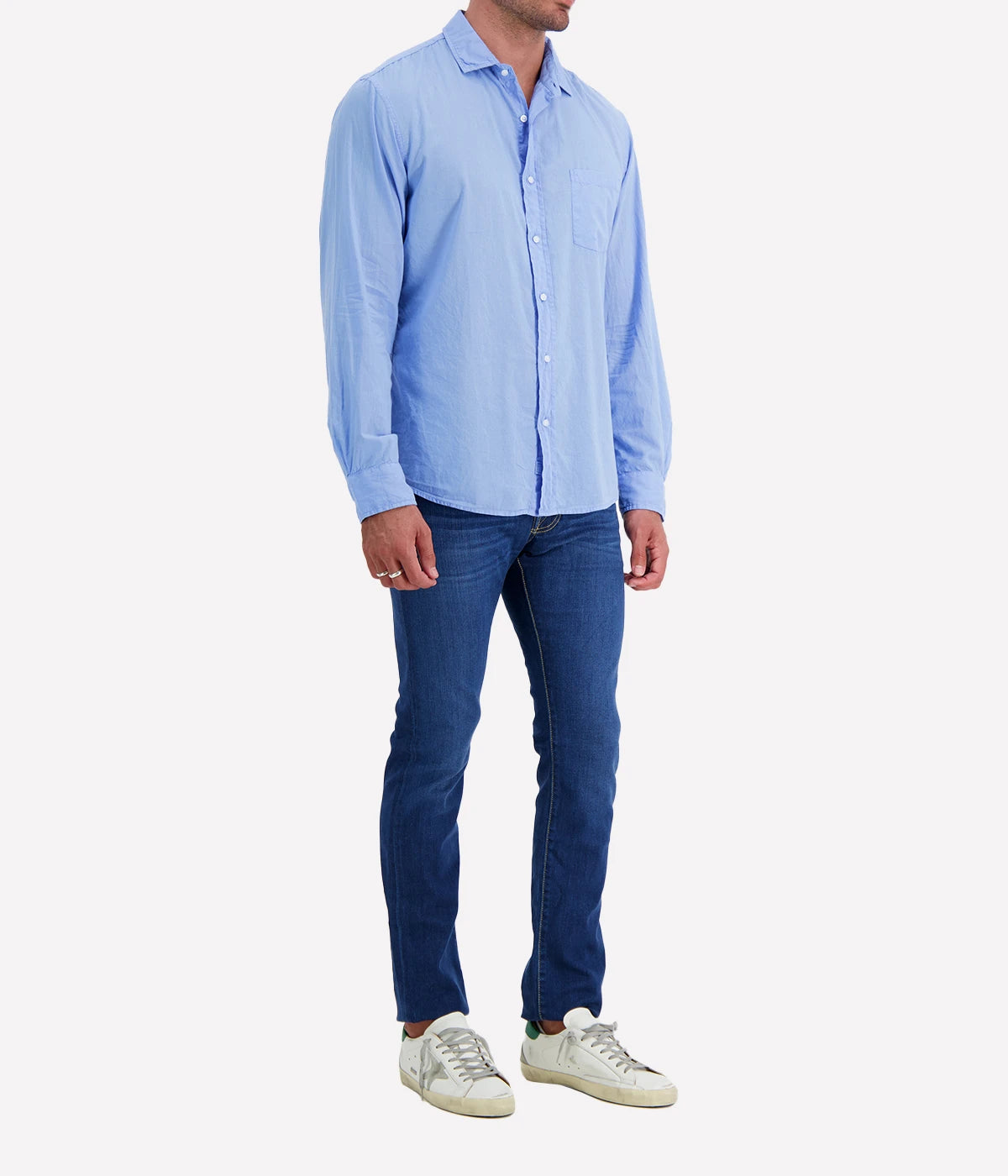 A side view of the Luke Woven Button Down Shirt, highlighting its structured silhouette and clean lines along the sleeves and hem.