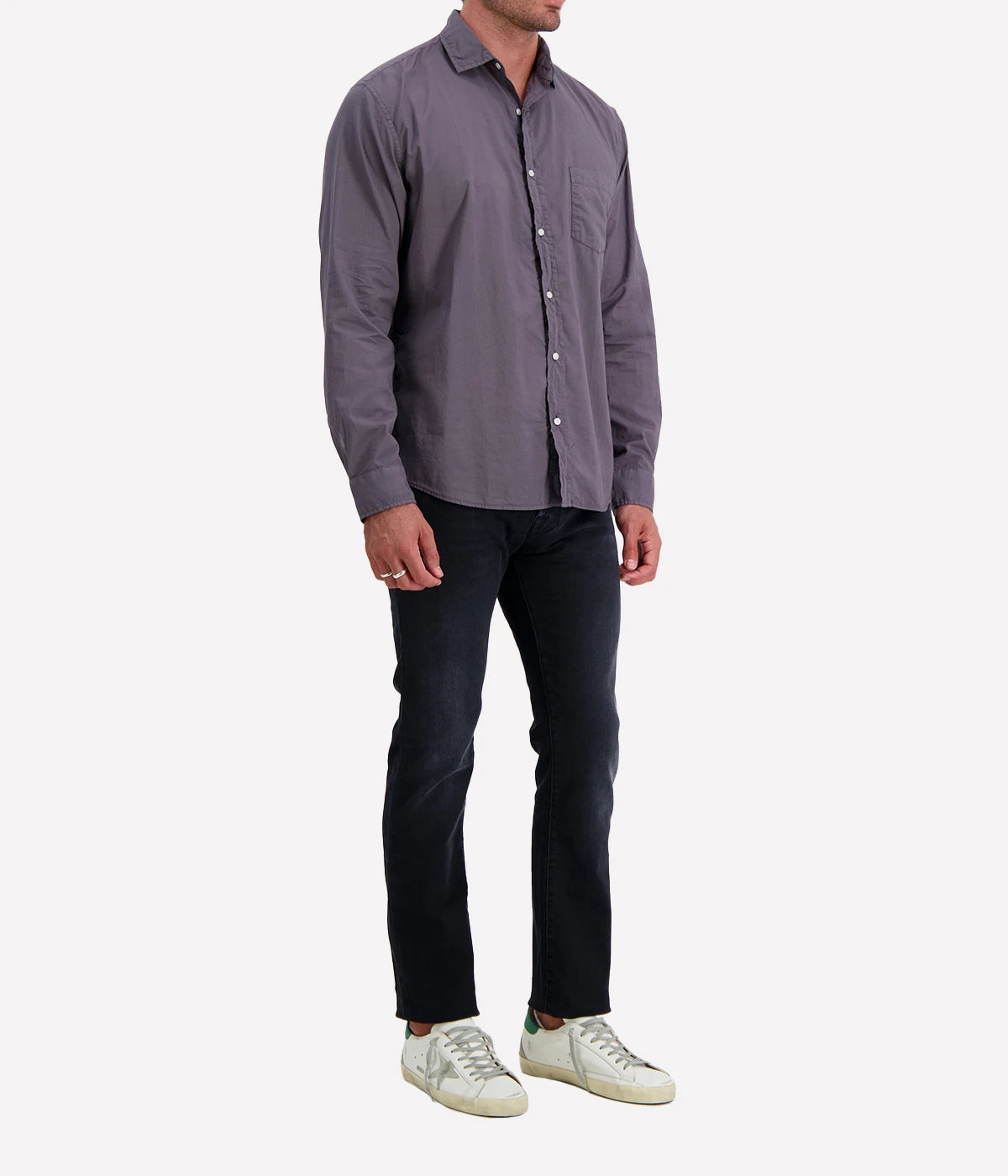 A side view of the Luke Woven Button Down Shirt, highlighting its structured silhouette and clean lines along the sleeves and hem.