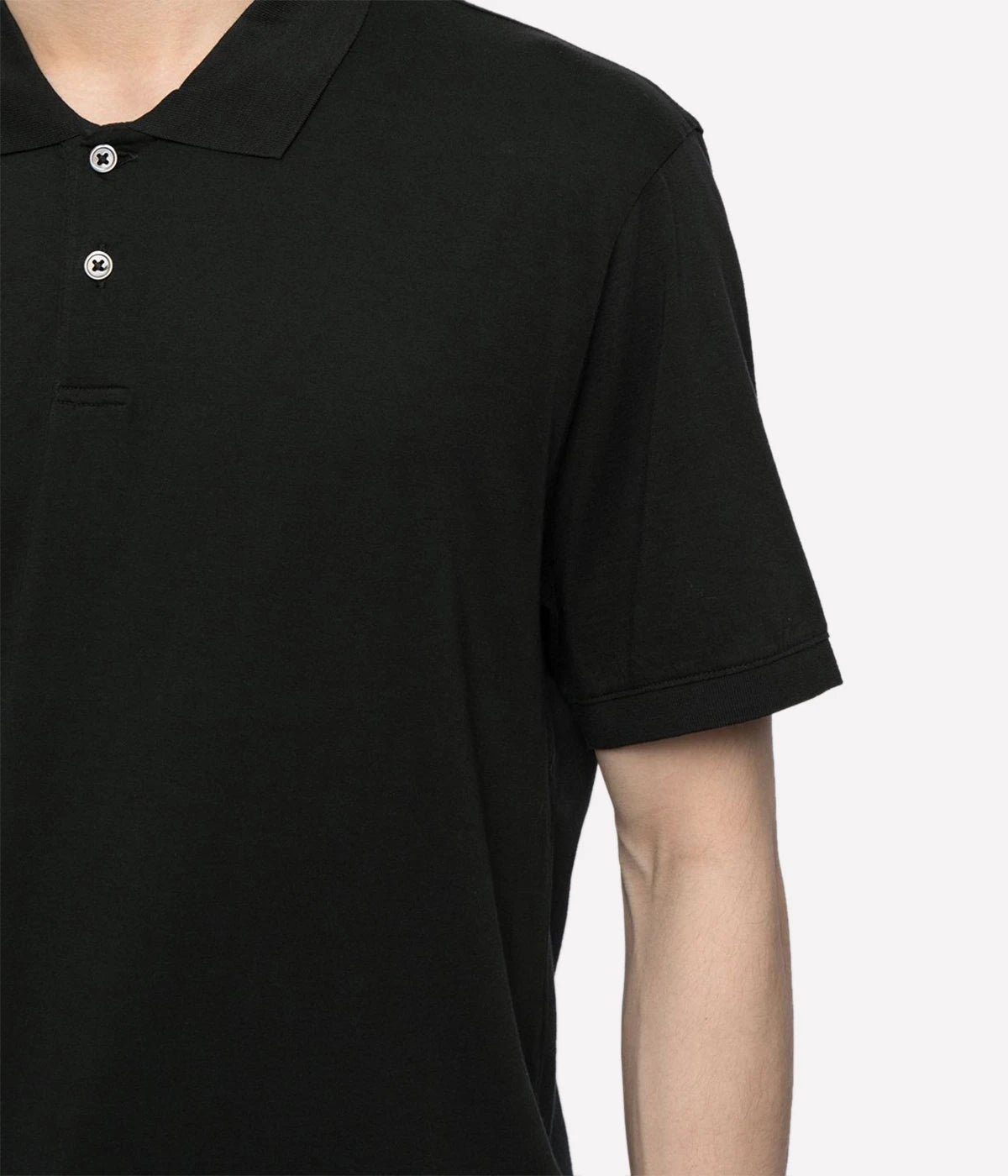 Detail shot of contrast ribbed knit collar and short sleeve hems and centre front polo placket with two button closure. A black relaxed polo shirt made of luxurious black jersey.