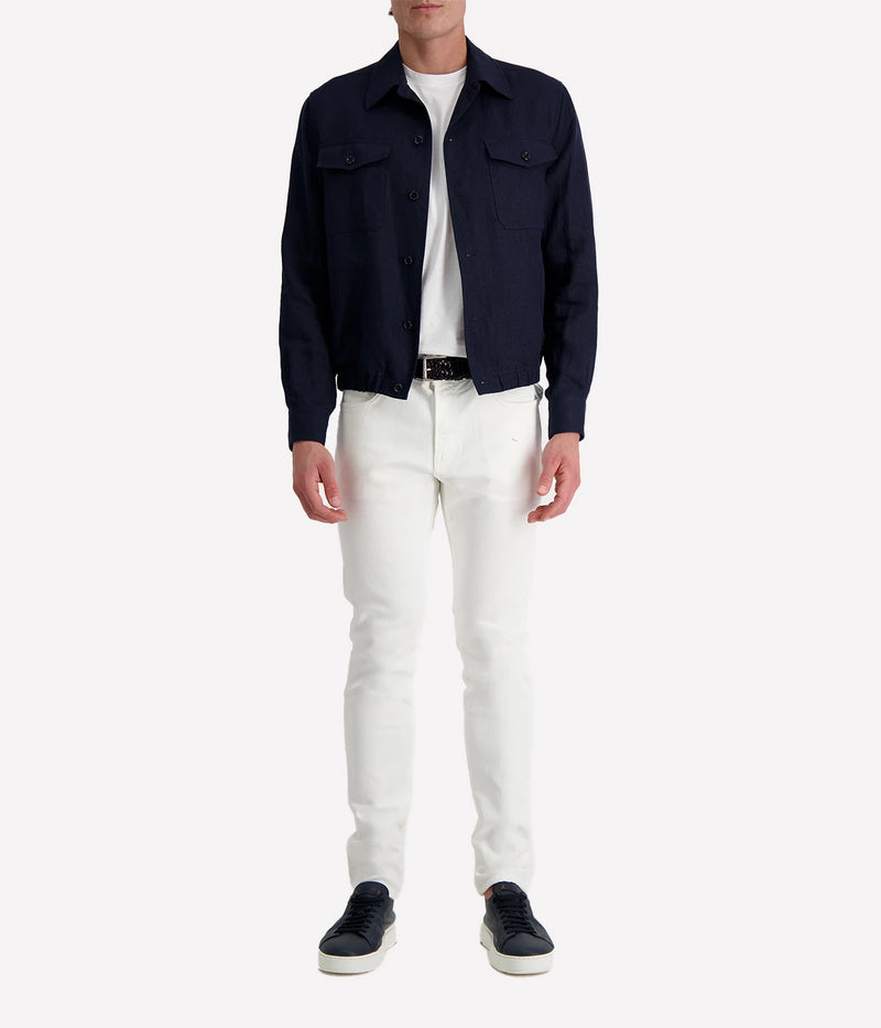 Lardini ‘Attitude’ jacket in dark navy linen blend with button front, flap chest pockets, and elasticated hem, styled over a white tee and white trousers.