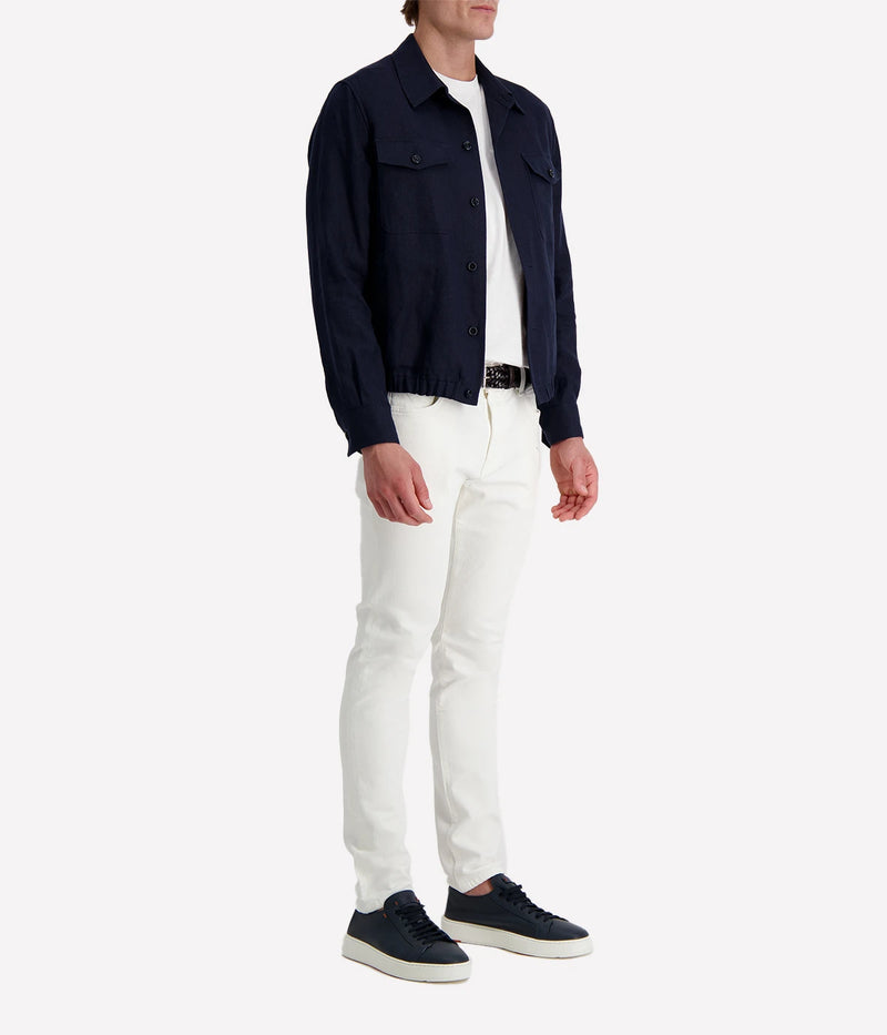 Lardini ‘Attitude’ jacket in dark navy linen blend with button front, flap chest pockets, and elasticated hem, styled over a white tee and white trousers.