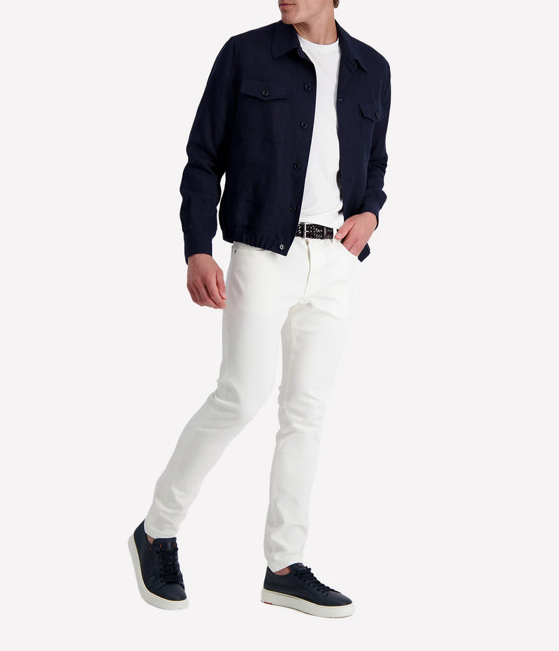 Lardini ‘Attitude’ jacket in dark navy linen blend with button front, flap chest pockets, and elasticated hem, styled over a white tee and white trousers.