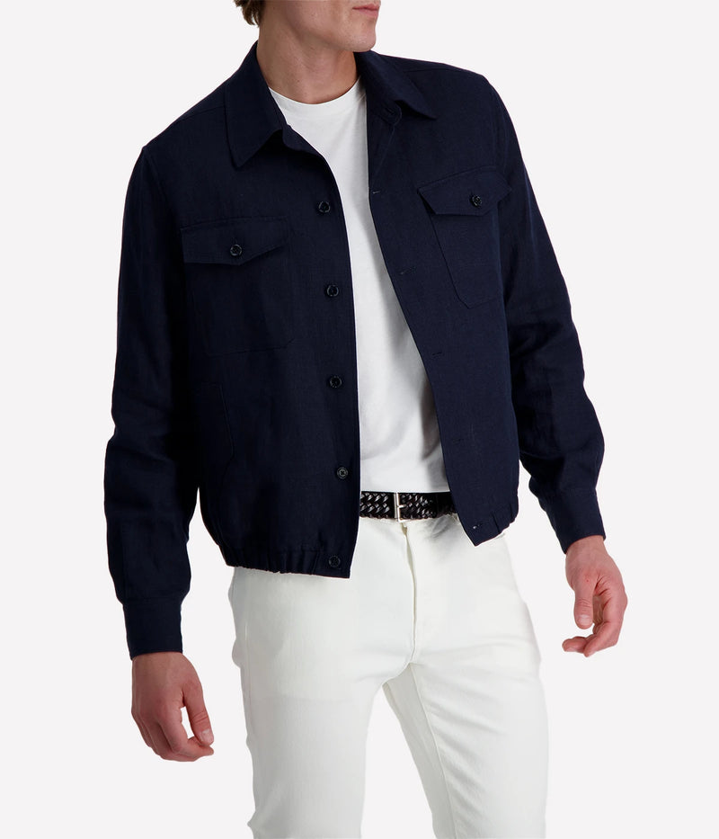 Lardini ‘Attitude’ jacket in dark navy linen blend with button front, flap chest pockets, and elasticated hem, styled over a white tee and white trousers.