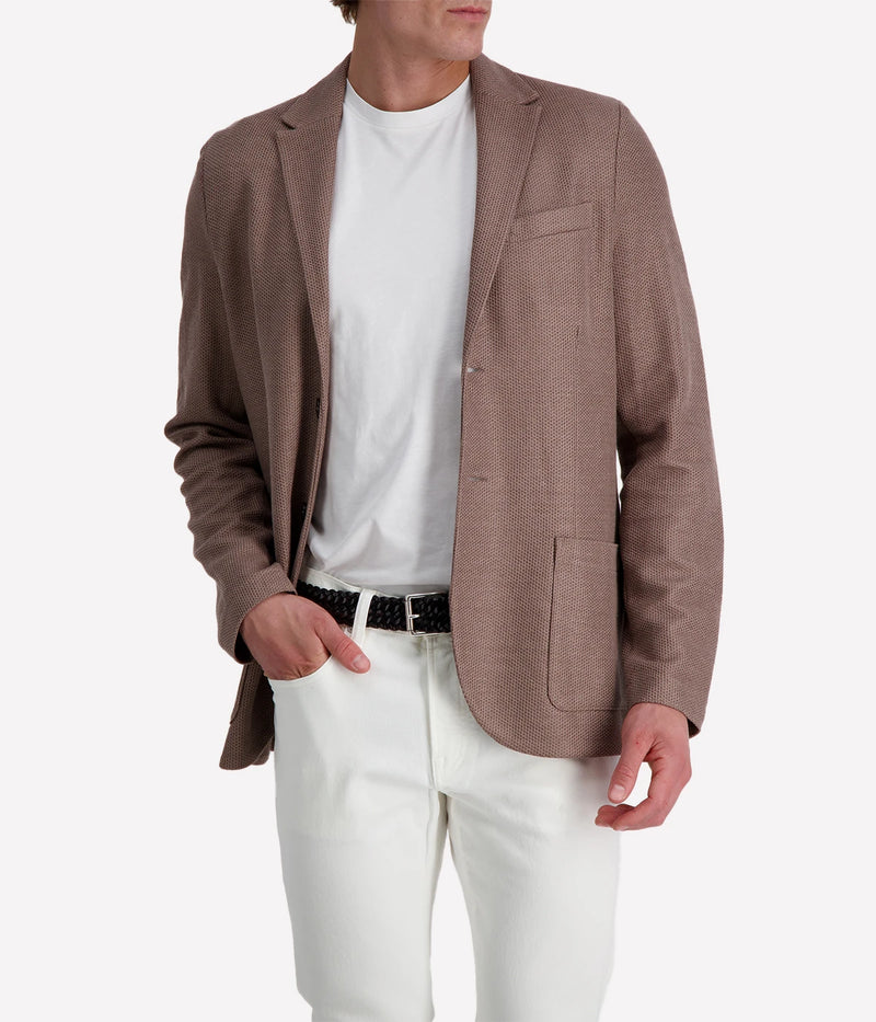 Knitted linen blend men's blazer with 2-button closure, notched collar, and patch pockets, unlined for lightweight summer layering. Made in Italy.