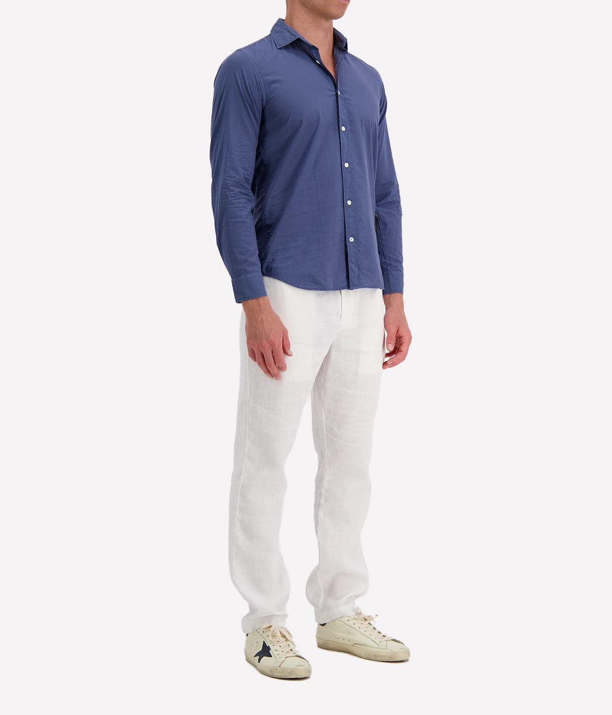 Model wearing the Hartford Sammy Shirt in lightweight cotton voile, featuring a pointed collar and buttoned cuffs. The slim fit creates a flattering, clean silhouette, perfect for casual summer styling.