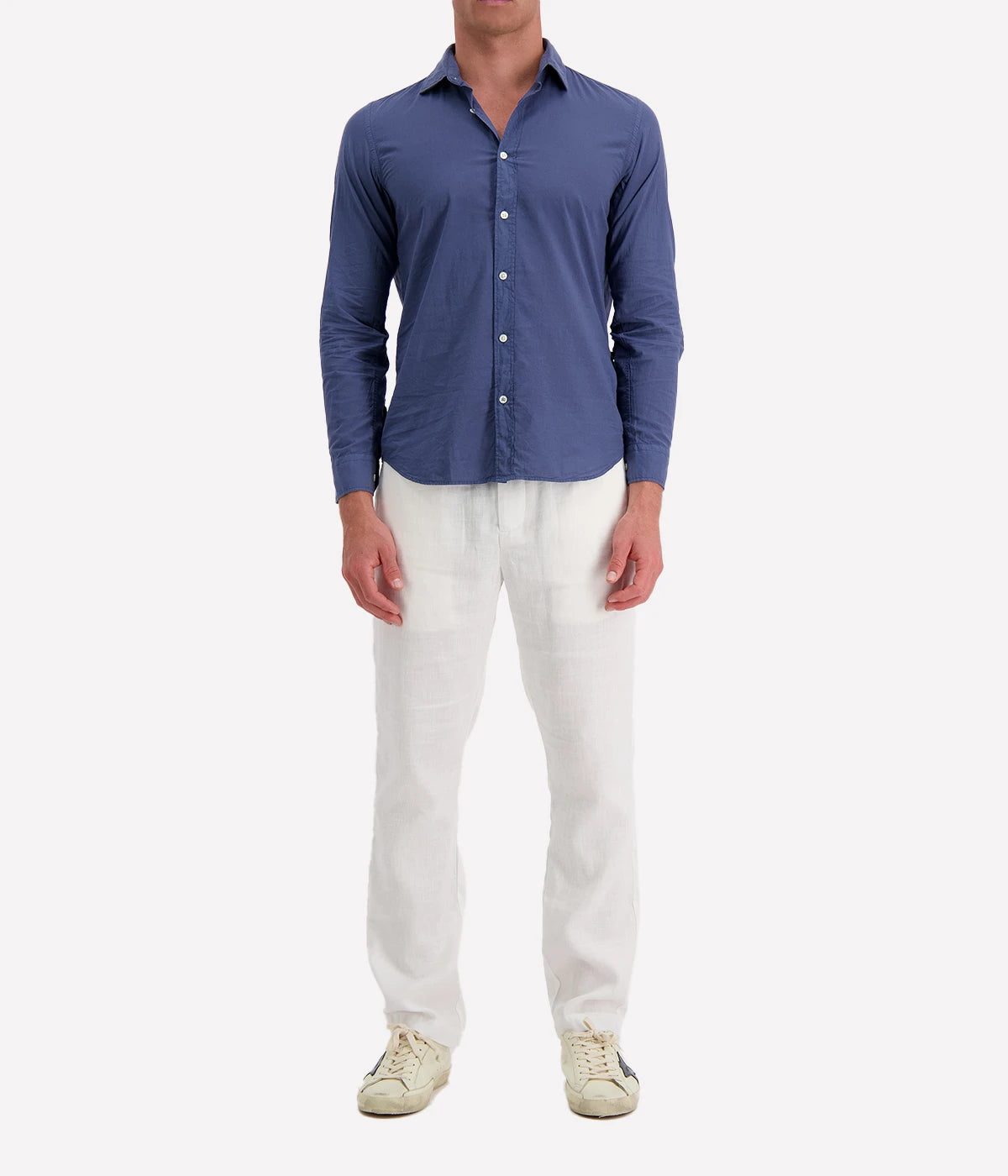 Model wearing the Hartford Sammy Shirt in lightweight cotton voile, featuring a pointed collar and buttoned cuffs. The slim fit creates a flattering, clean silhouette, perfect for casual summer styling.