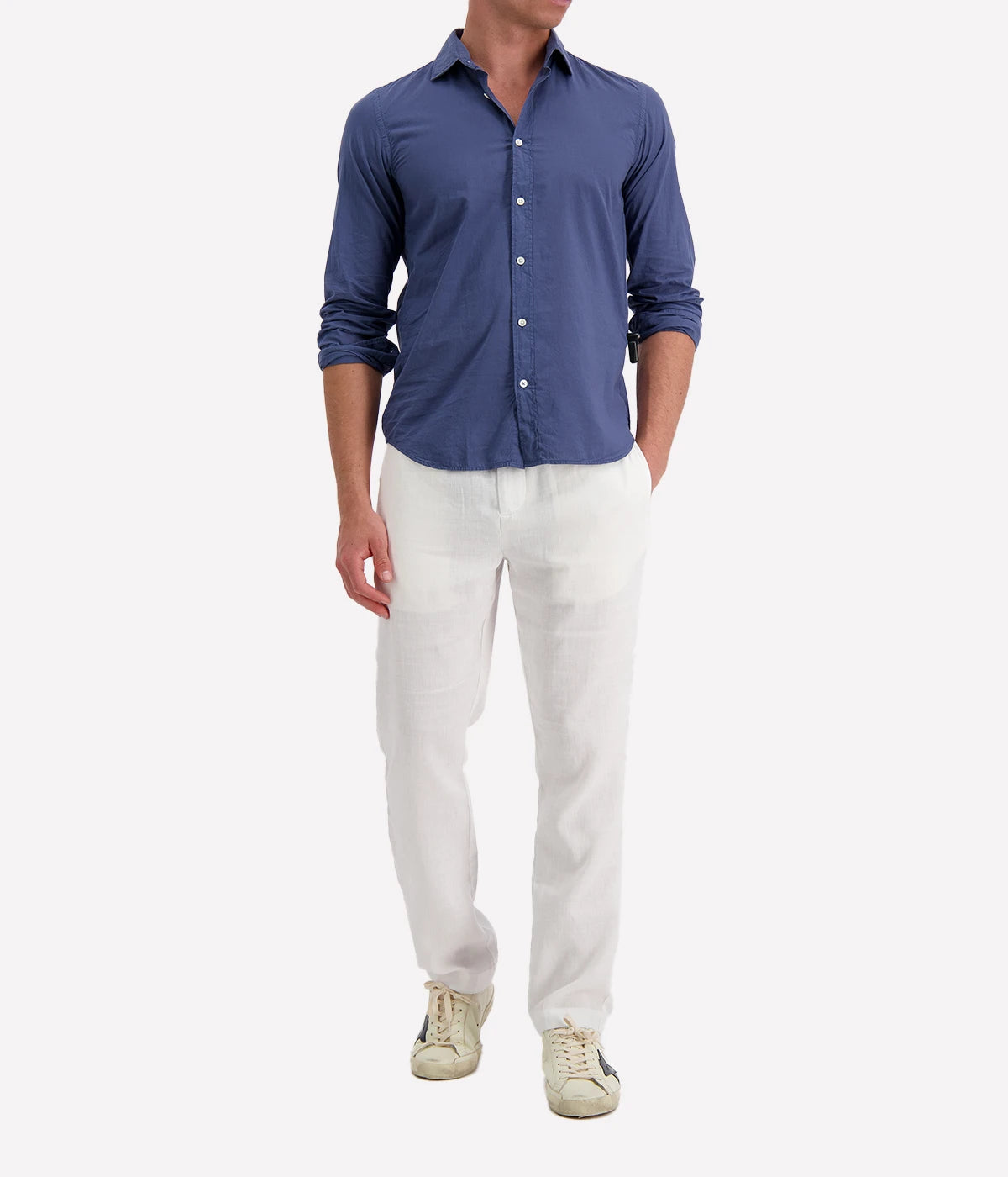 Model wearing the Hartford Sammy Shirt in lightweight cotton voile, featuring a pointed collar and buttoned cuffs. The slim fit creates a flattering, clean silhouette, perfect for casual summer styling.
