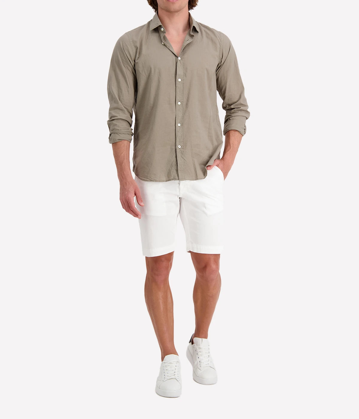 Model wearing the Hartford Sammy Shirt in lightweight cotton voile, featuring a pointed collar and buttoned cuffs. The slim fit creates a flattering, clean silhouette, perfect for casual summer styling.