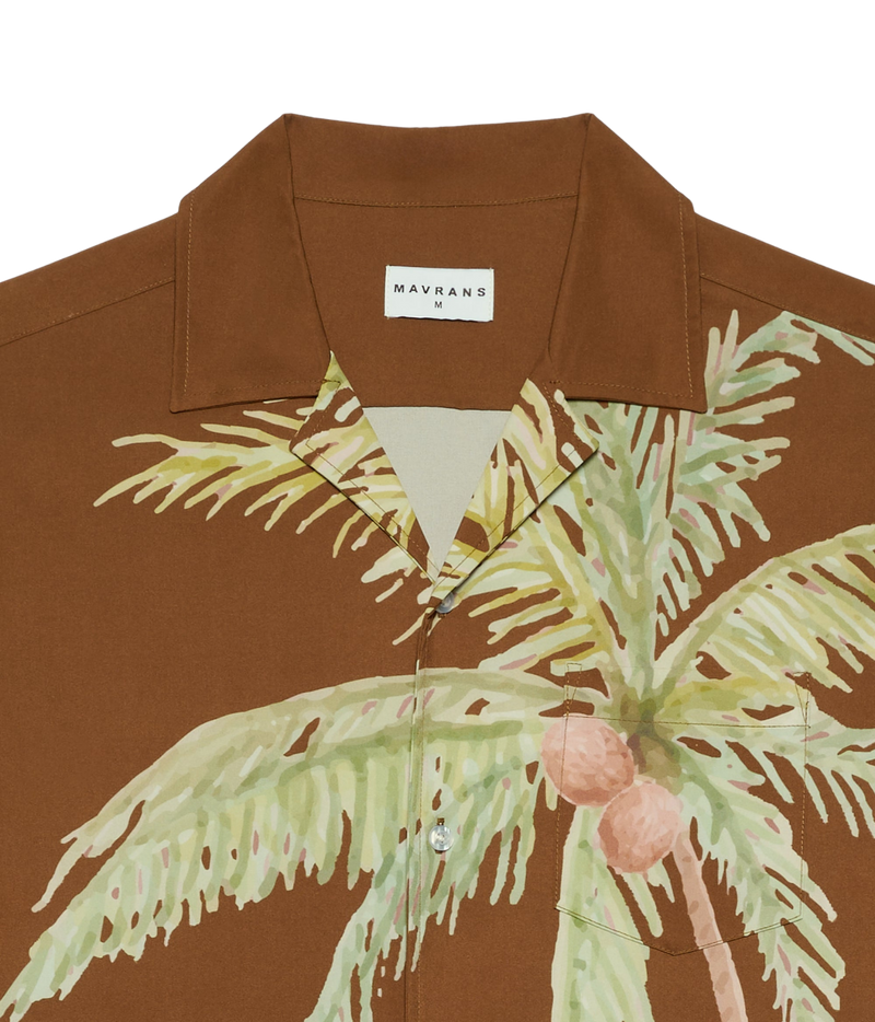 Close-up of Mavrans Coco Weekend Shirt in Brown showing the palm print, collar and neck label