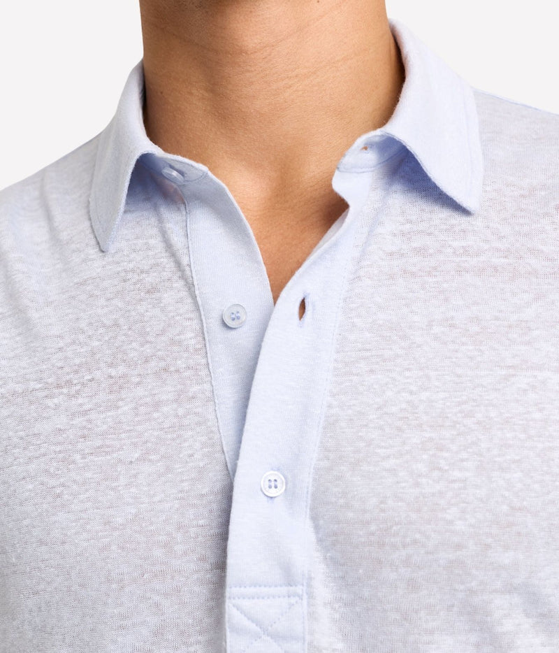 Close-up of Orlebar Brown Sebastian Tailored Linen Polo in Surfside Blue showing the two-piece collar and three-button placket