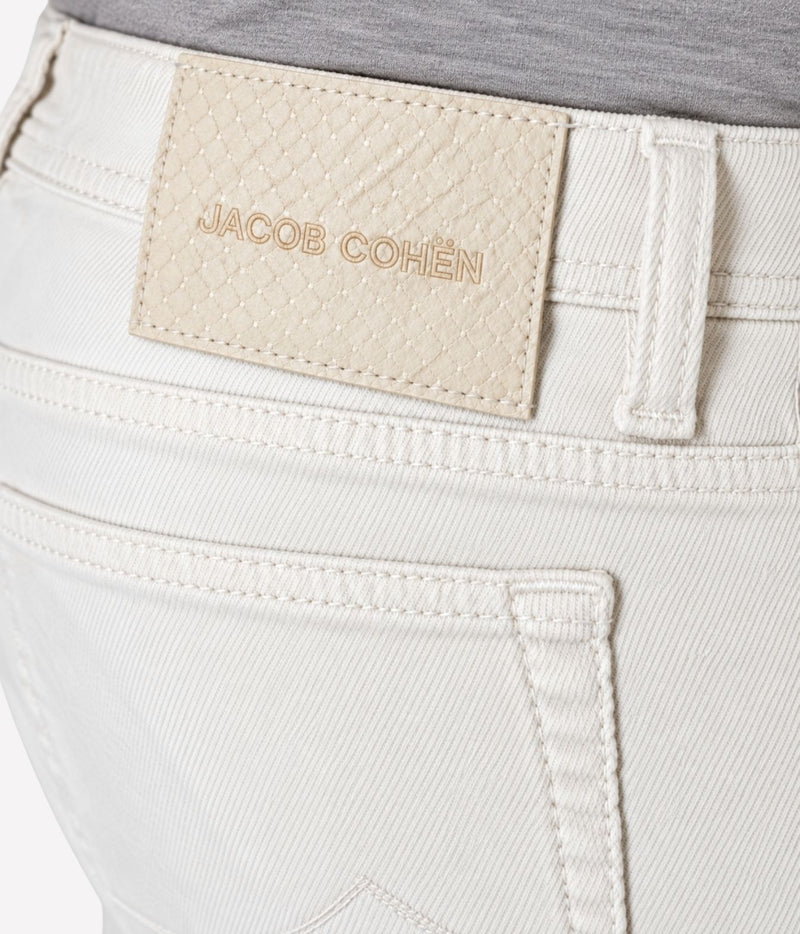 Close-up of Jacob Cohën Bard Regular-Slim Jeans in Washed Natural showing the woven back patch and back pocket