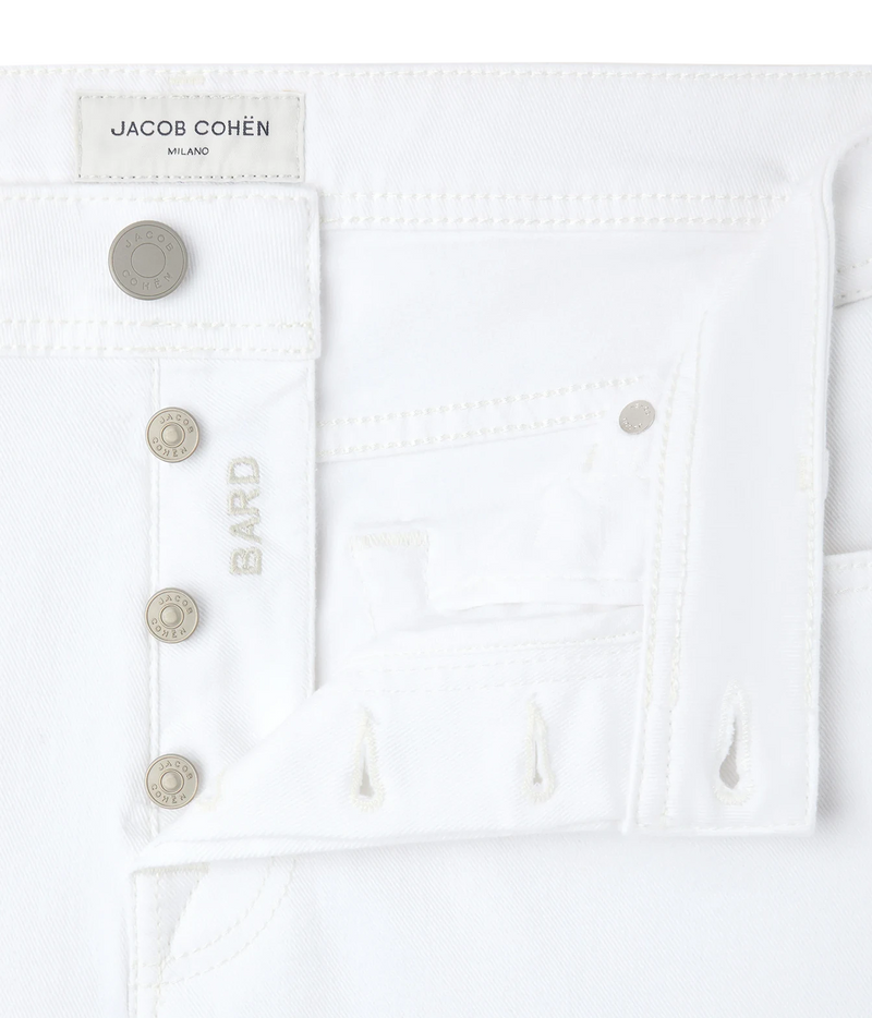 Close-up of Jacob Cohën Bard Slim Fit Pant in White showing the button fly and logo buttons