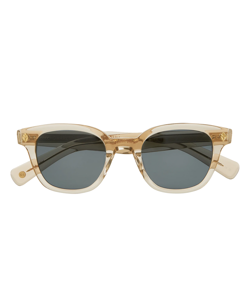 Cured cellulose acetate frame with stainless steel core wire and palm leaf plaques on exaggerated endpieces. Five barrel hinges with real rivets for a durable, stylish fit. Bold, vintage-inspired design.