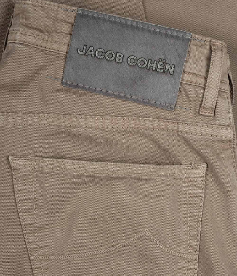 Close-up of Jacob Cohen Nick 5-Pocket Jeans showing the suede logo patch, branded button, and detailed stitching on premium stretch denim.