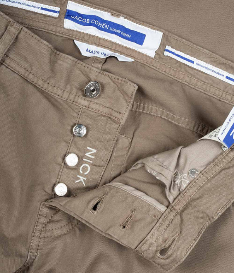 Close-up of Jacob Cohen Nick 5-Pocket Jeans showing the suede logo patch, branded button, and detailed stitching on premium stretch denim.