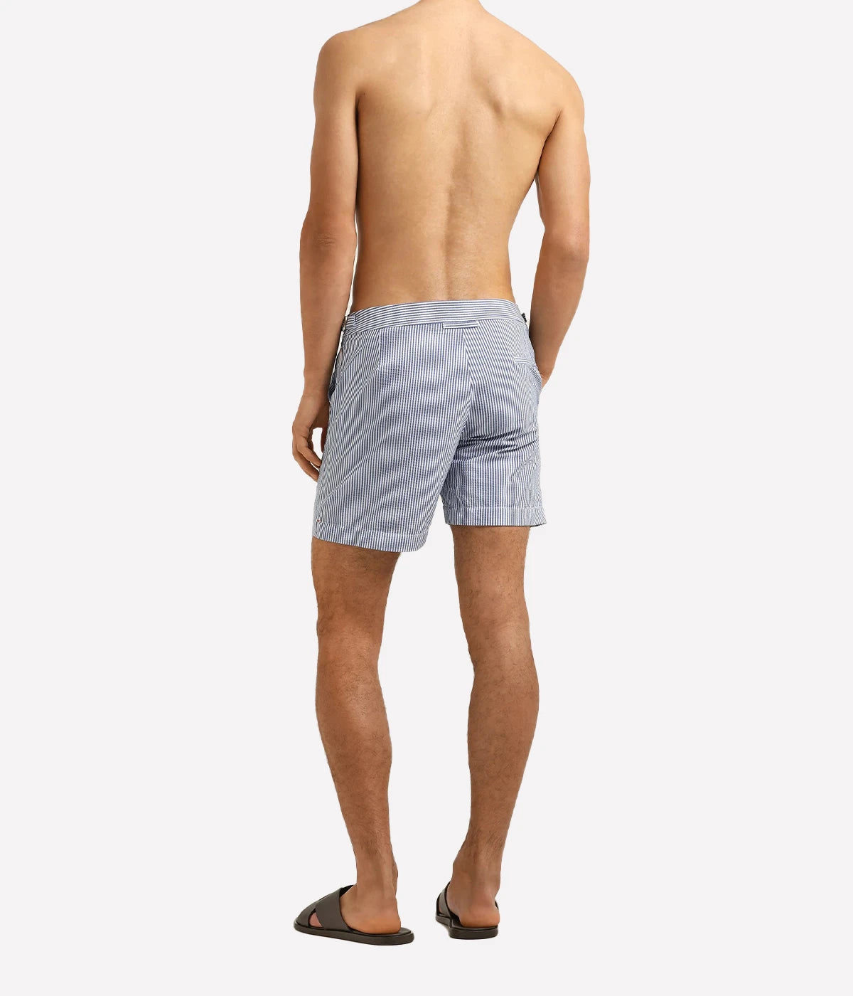 Orlebar Brown Bulldog Seersucker Stripe Shorts in Nova Blue & White Stripe with a tailored mid-length fit and lightweight seersucker fabric - Full Length Back Shot