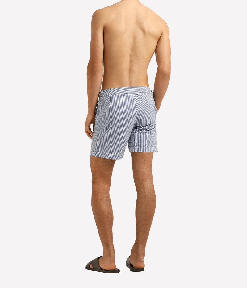 Orlebar Brown Bulldog Seersucker Stripe Shorts in Nova Blue & White Stripe with a tailored mid-length fit and lightweight seersucker fabric - Full Length Back Shot
