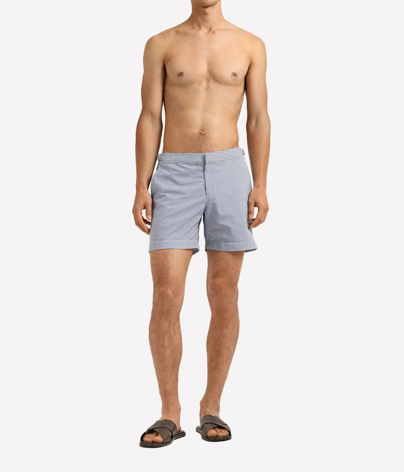 Orlebar Brown Bulldog Seersucker Stripe Shorts in Nova Blue & White Stripe with a tailored mid-length fit and lightweight seersucker fabric - Full Length Front Shot