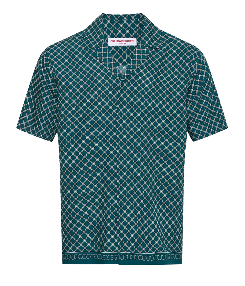 A short-sleeve button-up shirt by Balenciaga, featuring a dark teal green and white geometric lattice pattern.