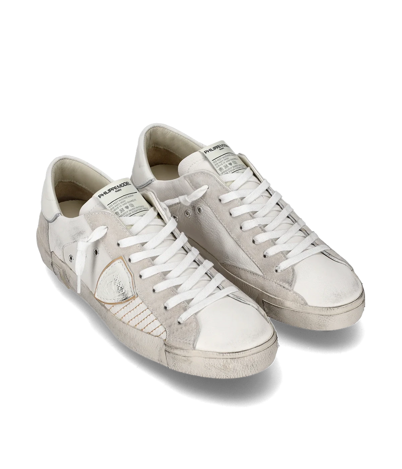The PRSX sneaker in all-white puts a modern spin on ‘80s skate style with a worn-effect leather and suede upper, handcrafted rubber sole, and street-inspired details.