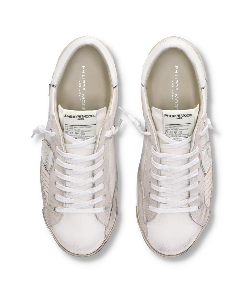 The PRSX sneaker in all-white puts a modern spin on ‘80s skate style with a worn-effect leather and suede upper, handcrafted rubber sole, and street-inspired details.