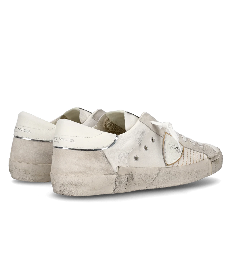 The PRSX sneaker in all-white puts a modern spin on ‘80s skate style with a worn-effect leather and suede upper, handcrafted rubber sole, and street-inspired details.