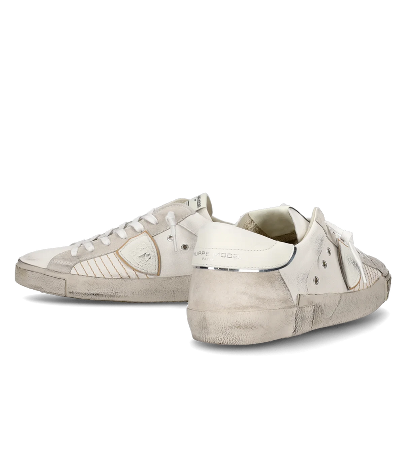 The PRSX sneaker in all-white puts a modern spin on ‘80s skate style with a worn-effect leather and suede upper, handcrafted rubber sole, and street-inspired details.