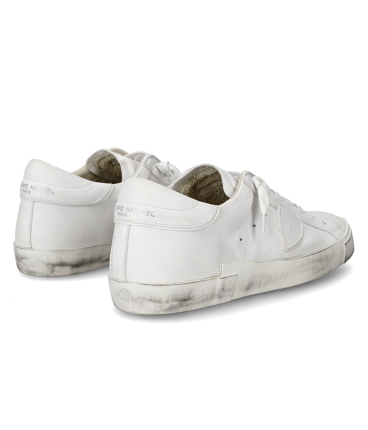Philippe Model PRSX Low Man in Basic Blanc shown as a pair from a side angle, highlighting the white leather upper and side shield patch