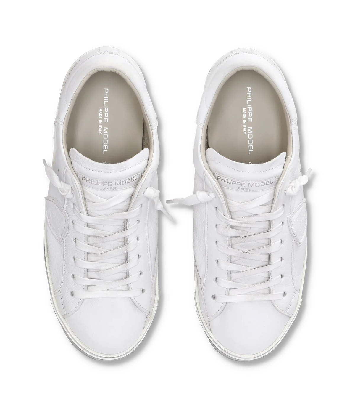 Top-down view of the Philippe Model PRSX Low Man in Basic Blanc pair, showing the white laces and rounded toe