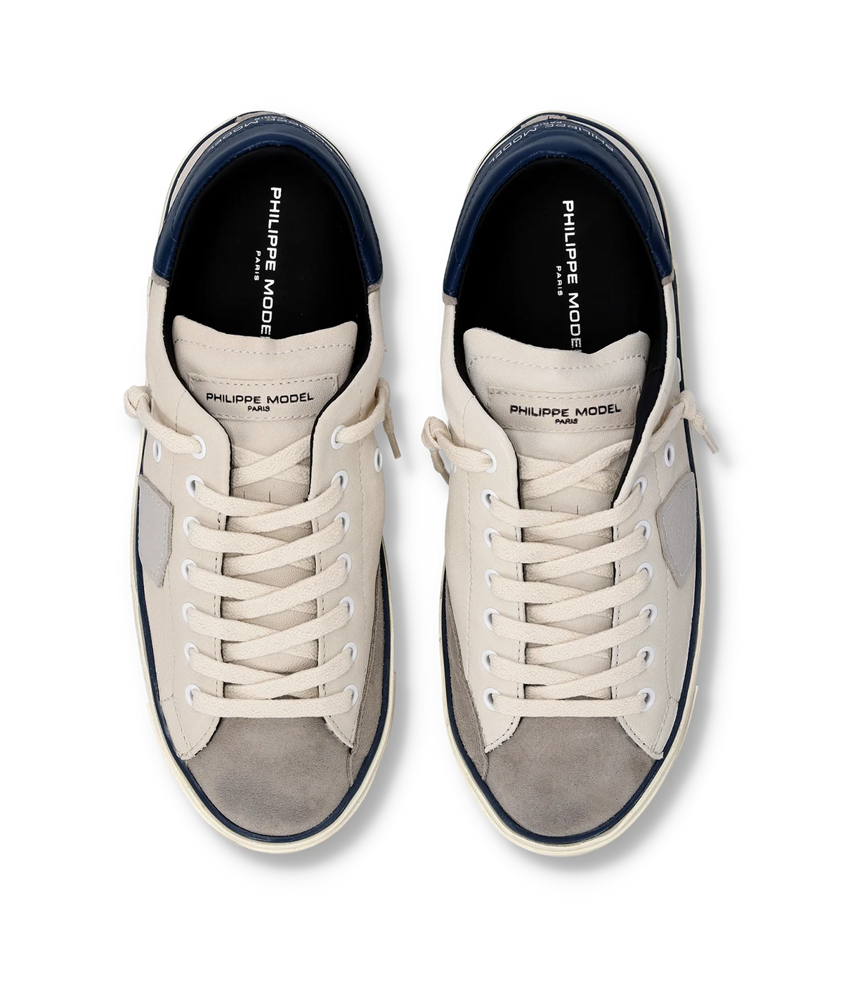 Top-down view of the Philippe Model Prsx Low Man in Vintage Bordure Lait Bleu pair, showing the white laces, navy lining and grey suede toe caps