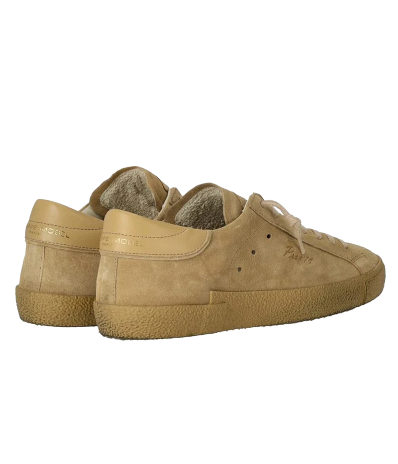 The Philippe Model PRSX Low Daim 70 sneaker combines premium leather and suede in tonal beige for a refined, casual look. Features laminated accents, a subtle "Prsx'78" print, cotton laces, and a comfortable rubber sole.