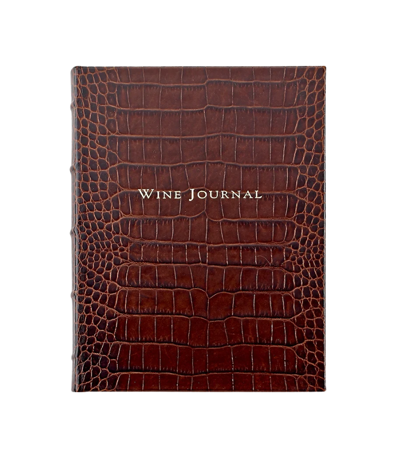 Luxury leather-bound wine journal with 224 pages, tabs for global wine selections, and gilt-edged, acid-free paper.