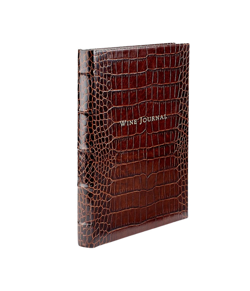 Luxury leather-bound wine journal with 224 pages, tabs for global wine selections, and gilt-edged, acid-free paper.