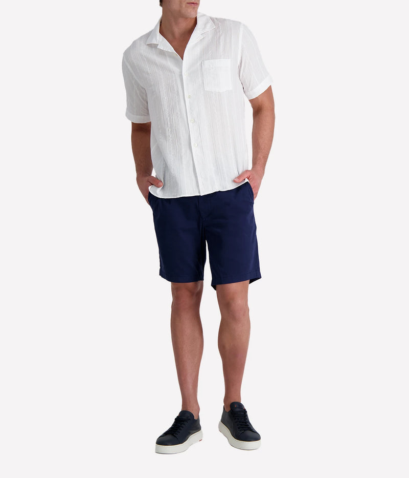 Men’s short-sleeve textured white cotton shirt with camp collar and chest pocket, designed in a regular fit for breathable, casual summer style.