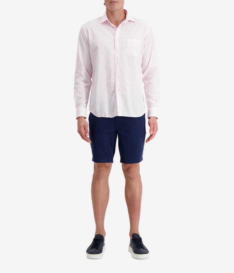Men’s pink and white striped seersucker shirt with a regular fit, chest pocket, and slightly open collar for a breezy, polished look.
