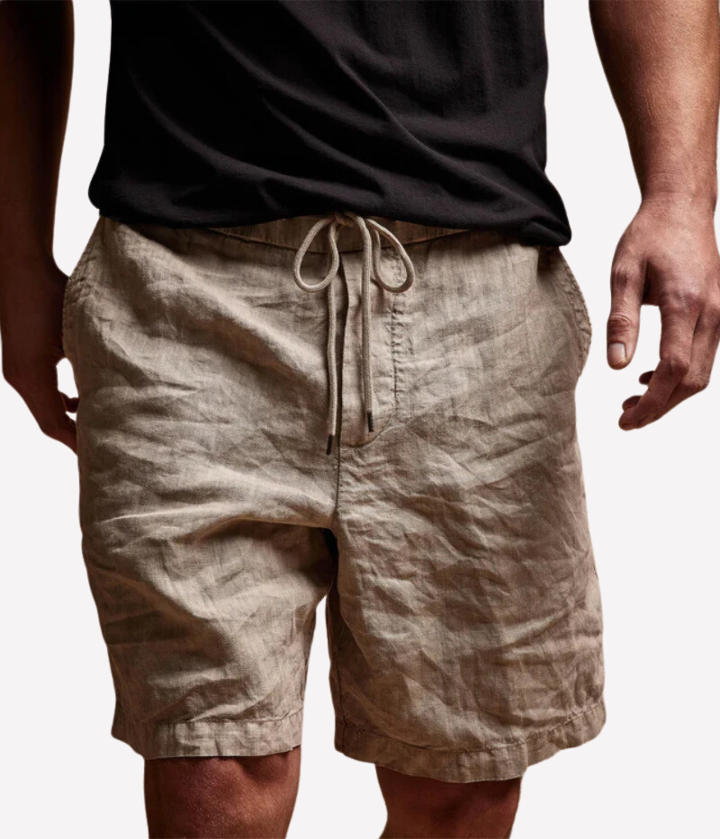 Relaxed Fit Linen Shorts in heavier linen fabric with a distinctive slub texture, featuring a clean front panel, elasticised waistband with drawcord, and slash front pockets. Garment-dyed for a lived-in, casual look.
