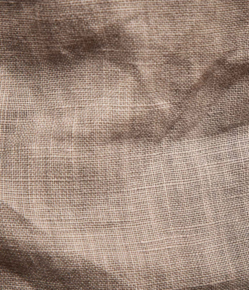 Close-up of the heavier linen fabric on the Relaxed Fit Linen Shorts, showcasing the visible slub texture that creates a unique high-and-low effect when dyed.