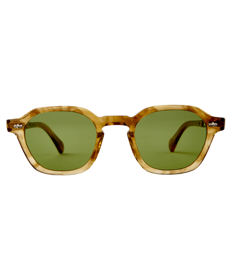 Sunglasses with tortoiseshell frame and green lenses on a white background