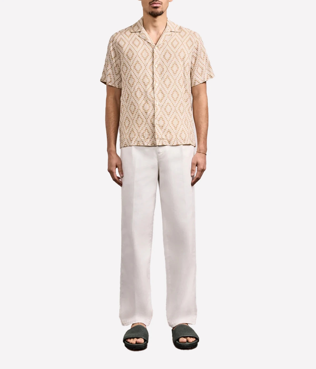 Men’s linen camp collar shirt featuring the seasonal Raffia Angra print, inspired by Brazilian coastal patterns, in a breathable relaxed fit.