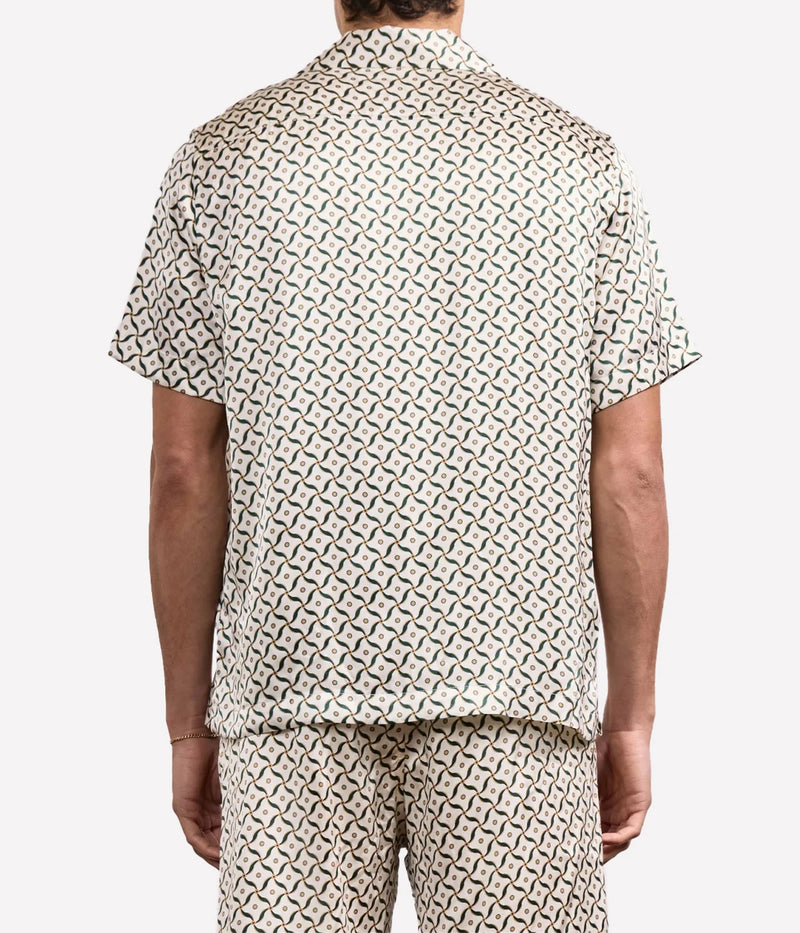 Men’s silk camp collar shirt by Frescobol Carioca with relaxed fit and all-over bespoke Lotus print, crafted from lightweight 100% silk.