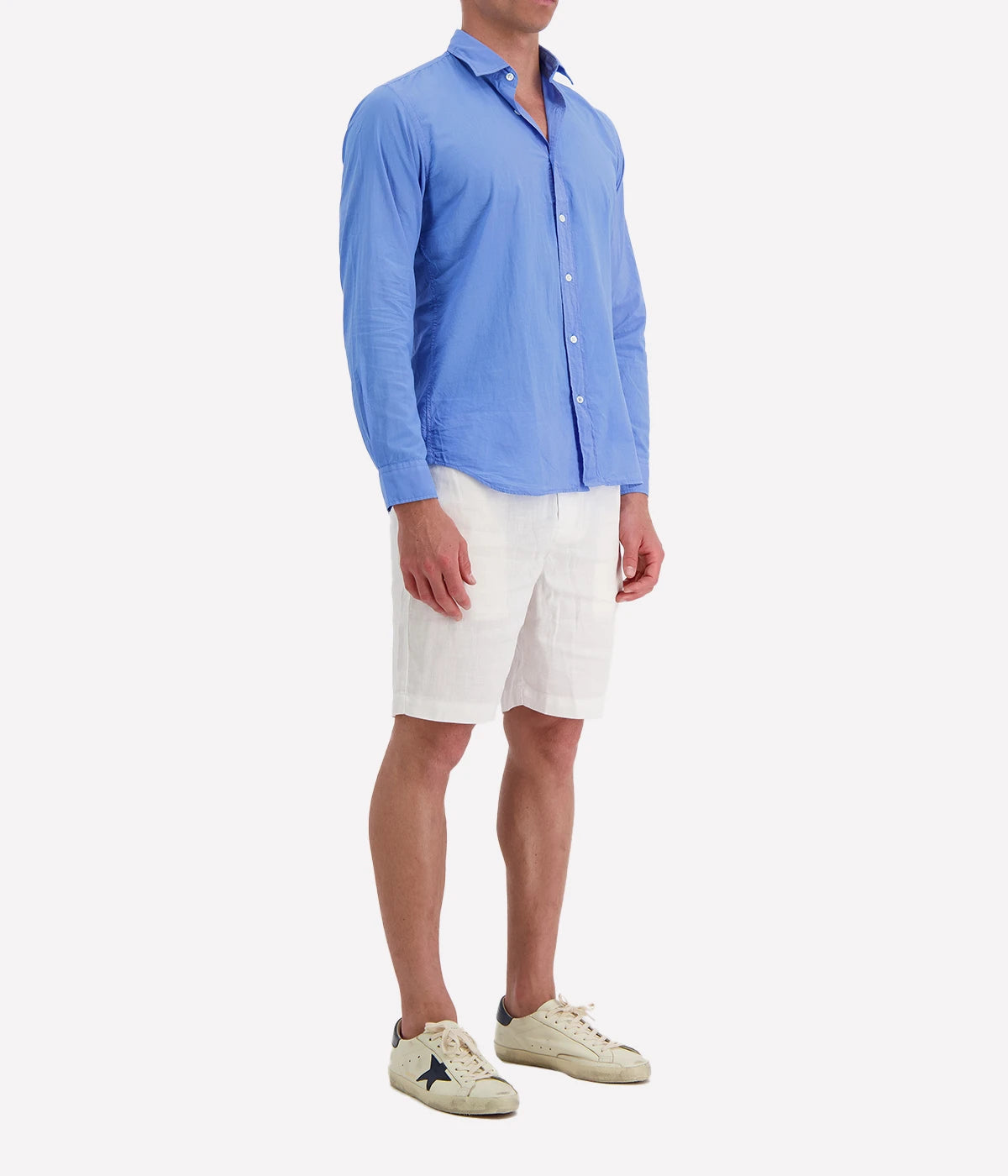 Side view of the Hartford Sammy Shirt, showing its slim fit and buttoned cuffs. The cotton voile fabric drapes softly for an effortlessly refined look.