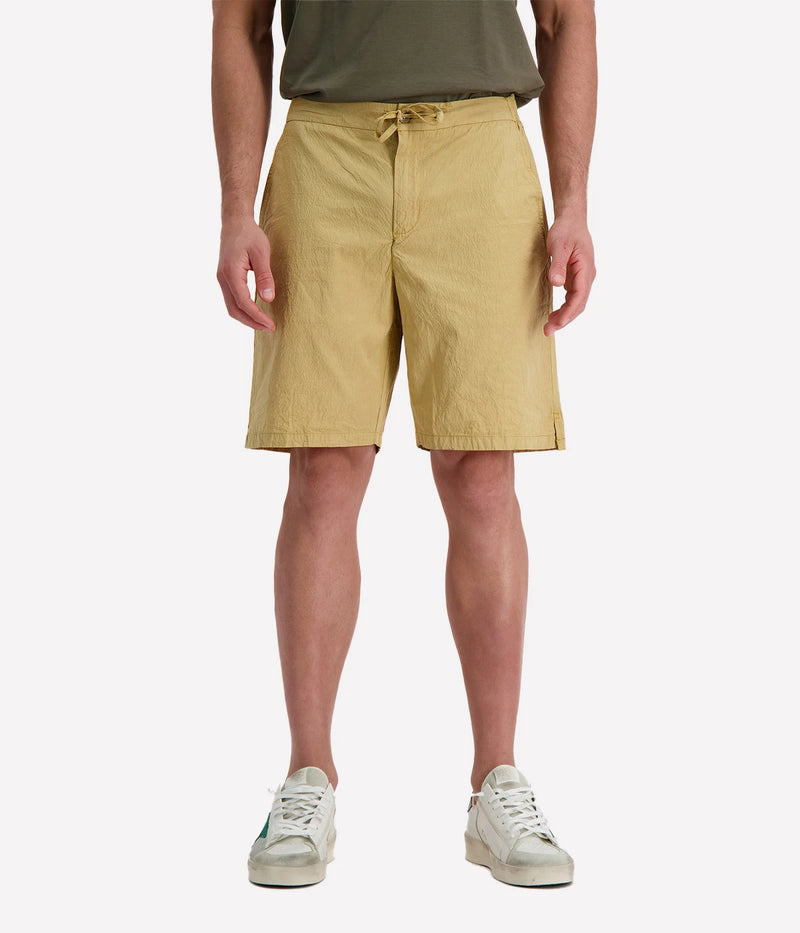 Men’s garment-dyed yellow Sergio Shorts with drawstring waist, made from soft Supima cotton with stretch for a relaxed yet refined fit.