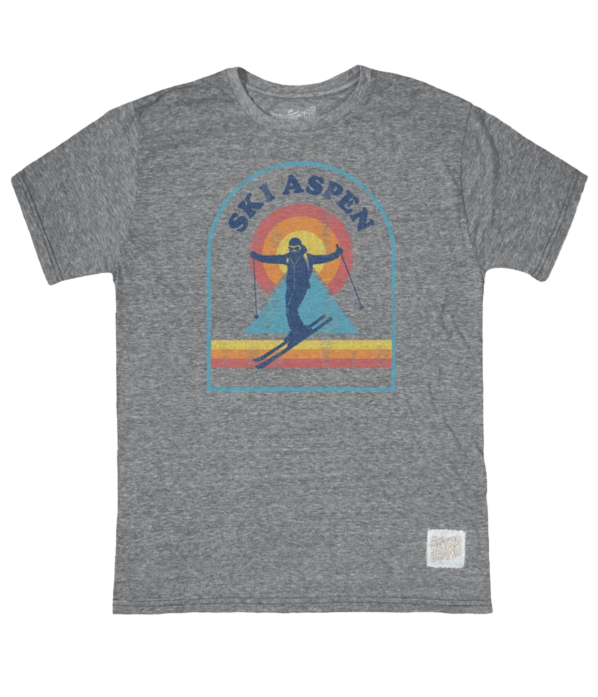 A grey t-shirt with a graphic print of a skier on a snowy mountain with a sunset background, and the text 'SKI ASPEN' above it.