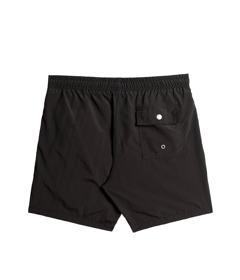 Back view of Bather solid swim trunks, showing the snap-closure back pocket and clean, tailored design. The ultra-fine mesh liner provides quick-dry functionality and four-way stretch for enhanced comfort.