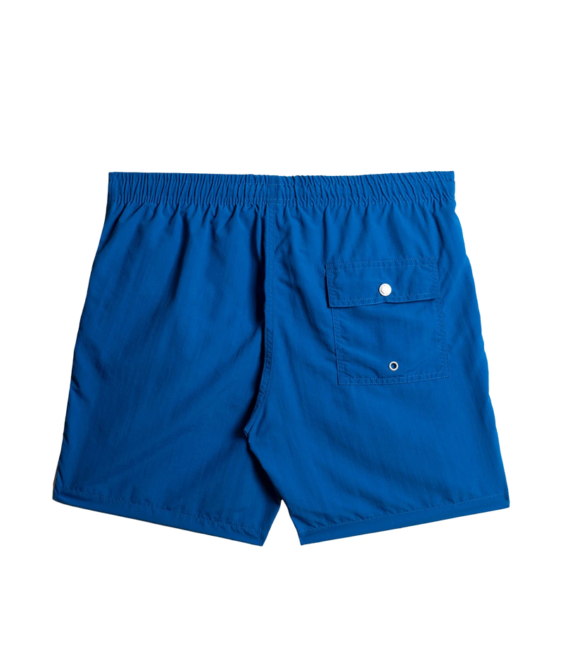 Back view of Bather solid swim trunks, showing the snap-closure back pocket and clean, tailored design. The ultra-fine mesh liner provides quick-dry functionality and four-way stretch for enhanced comfort.